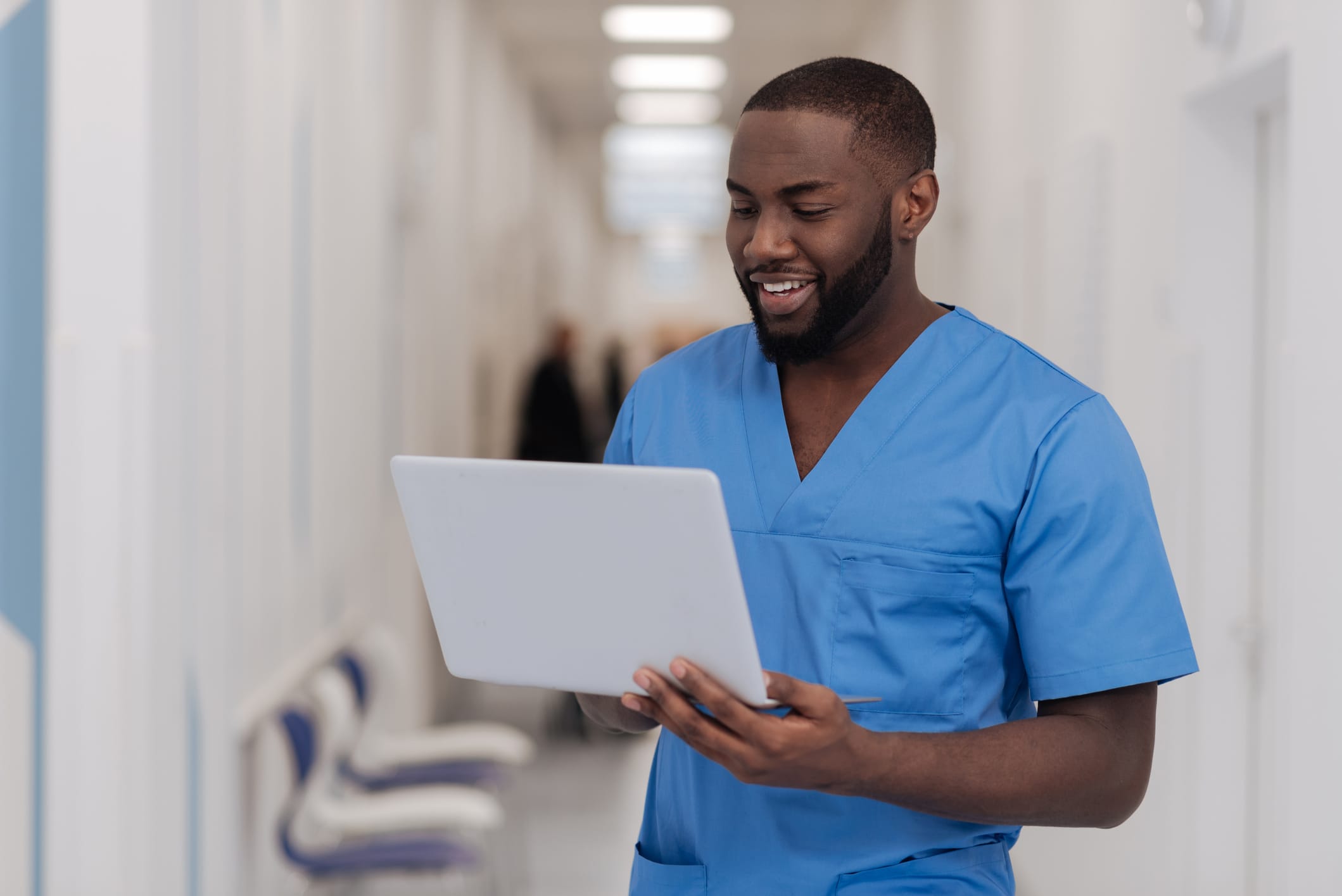 Male dental nurse completing online apprenticeship training